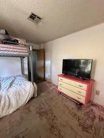a bathroom with a toilet and shower