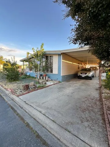 a view of a house with a street
