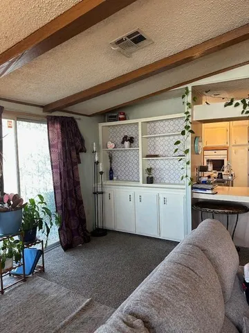 a living room with a couch and a window
