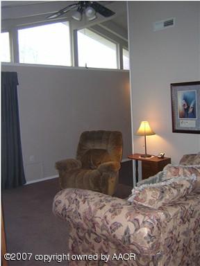 4616 South Bryan Street Amarillo, TX 79110 - Photo 2 of 12 a bedroom with a bed and a window