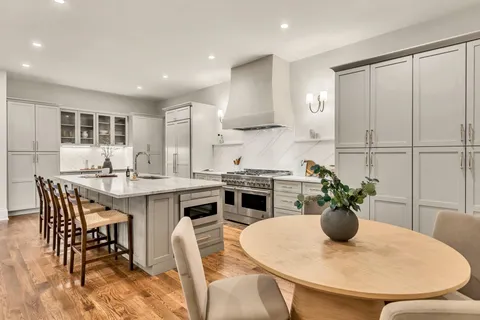 a kitchen with a sink and a refrigerator