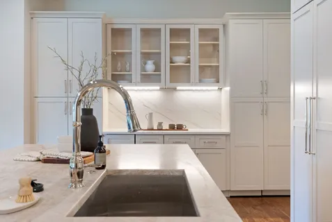 a bathroom with a double vanity sink and mirror