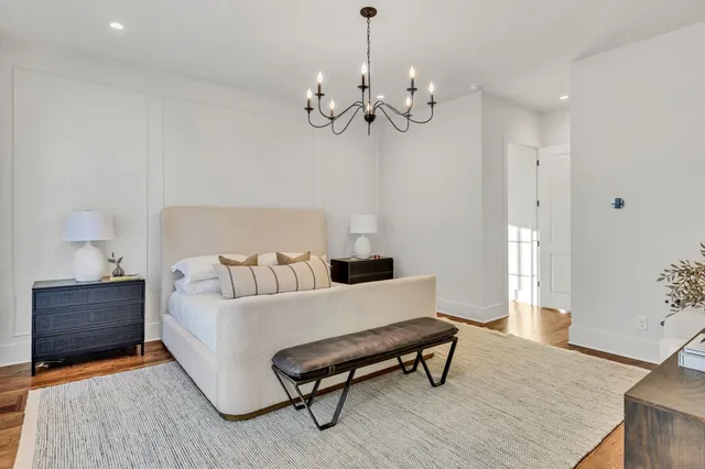 an empty room with windows and cabinet