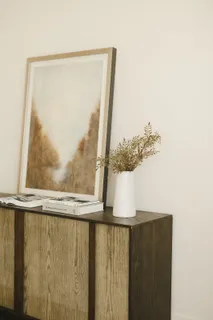 a living room with furniture and floor to ceiling window