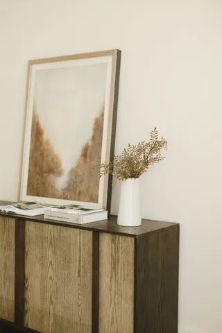 a living room with furniture and floor to ceiling window