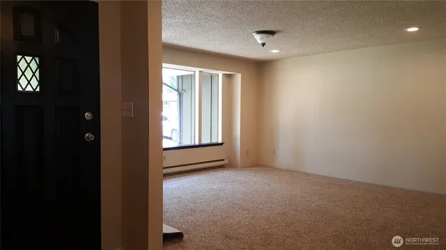 a view of an empty room with a window