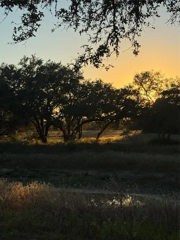 a view of an swimming pool with an outdoor space and seating area