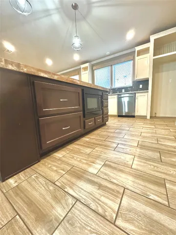 a spacious bathroom with a sink and a mirror