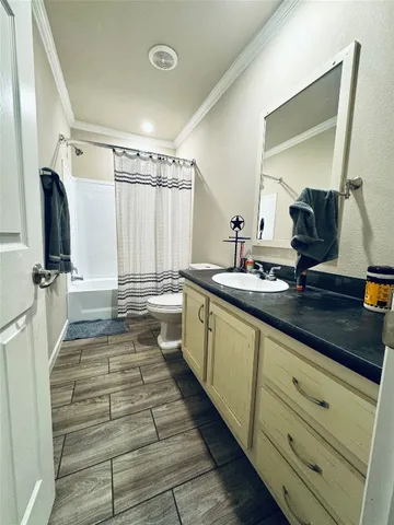 a bathroom with double vanity and a mirror