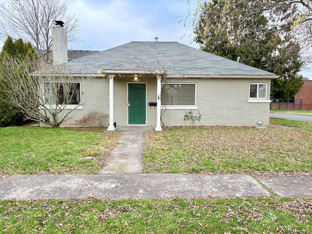 12305 Southwest 7th Street Beaverton, OR 97005 - Photo 1 of 23 a front view of house with yard