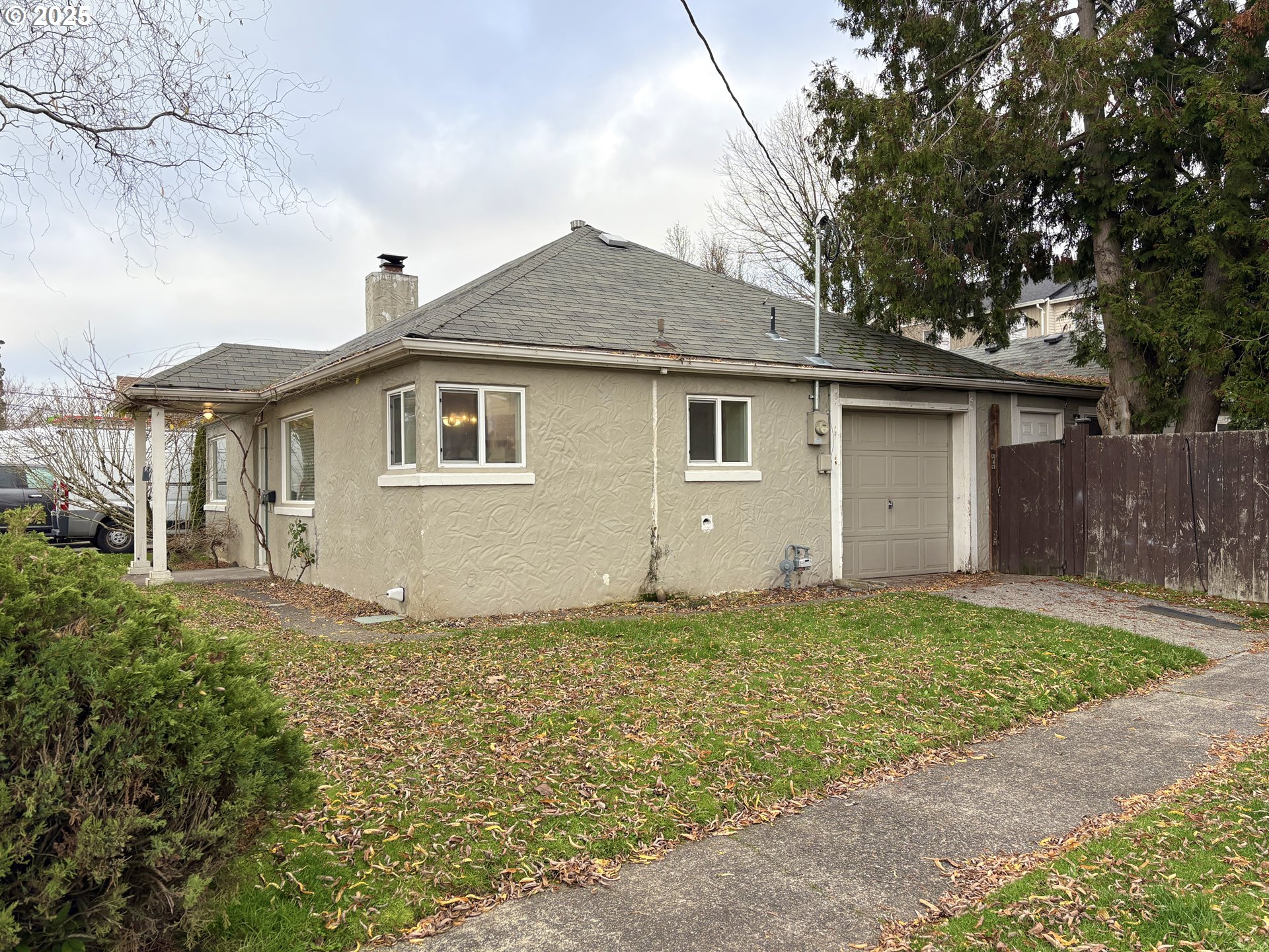 12305 Southwest 7th Street Beaverton, OR 97005 - Photo 2 of 23 a house with yard in front of it