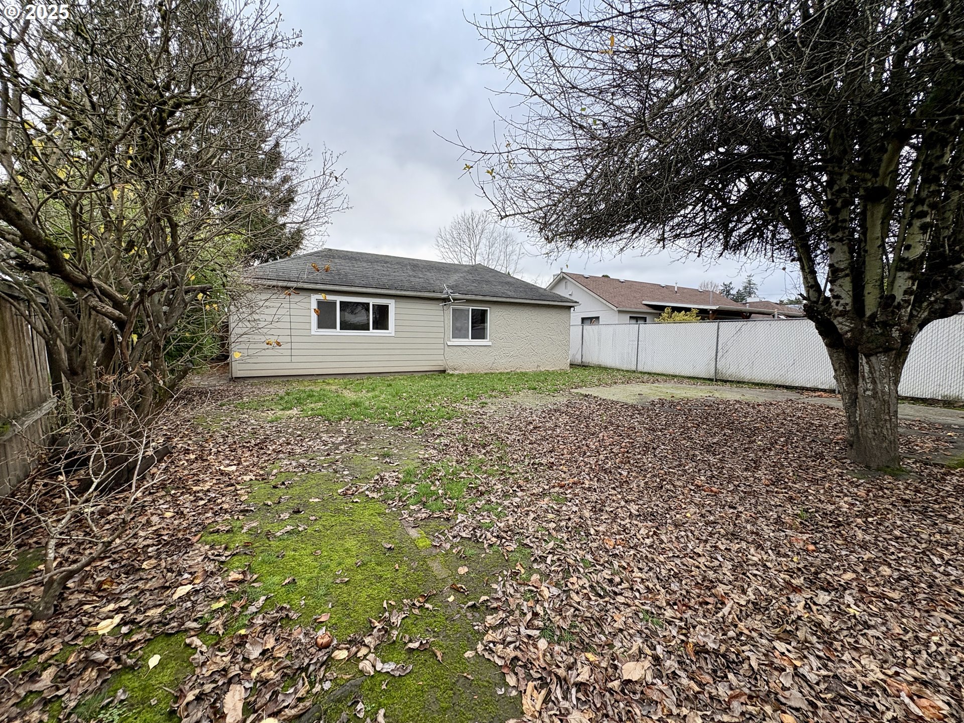 12305 Southwest 7th Street Beaverton, OR 97005 - Photo 21 of 23 front view of house with a trees