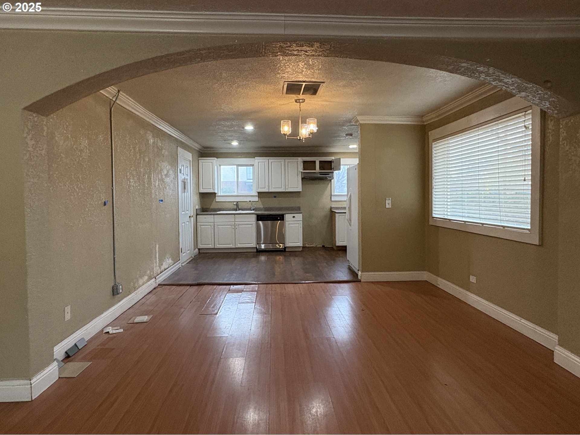 12305 Southwest 7th Street Beaverton, OR 97005 - Photo 4 of 23 a view of a kitchen with a sink and a refrigerator
