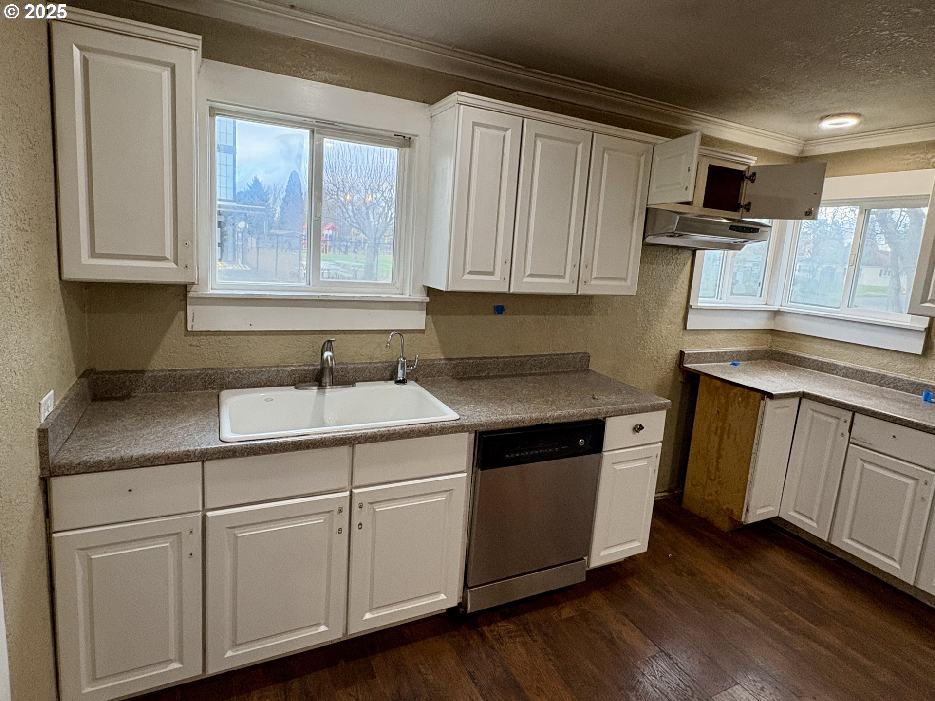 12305 Southwest 7th Street Beaverton, OR 97005 - Photo 5 of 23 a kitchen with cabinets appliances and a sink