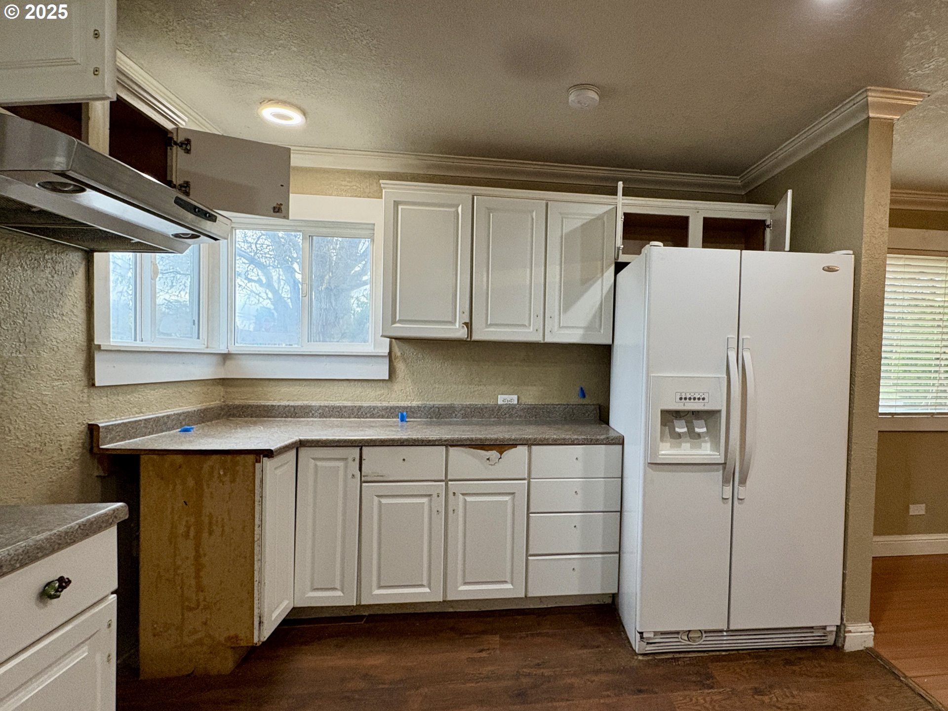 12305 Southwest 7th Street Beaverton, OR 97005 - Photo 6 of 23 a kitchen with stainless steel appliances a refrigerator and a stove
