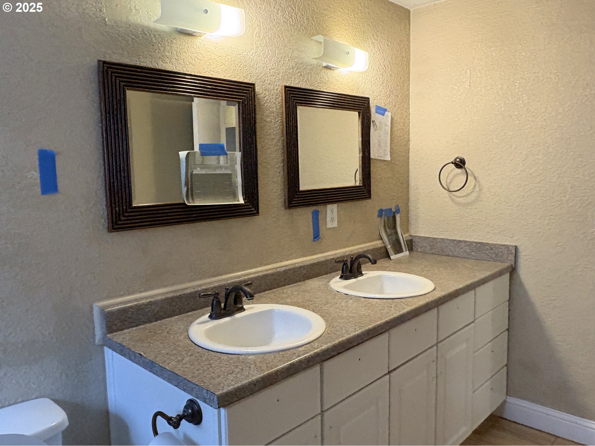 12305 Southwest 7th Street Beaverton, OR 97005 - Photo 10 of 23 a bathroom with a double vanity sink and a mirror