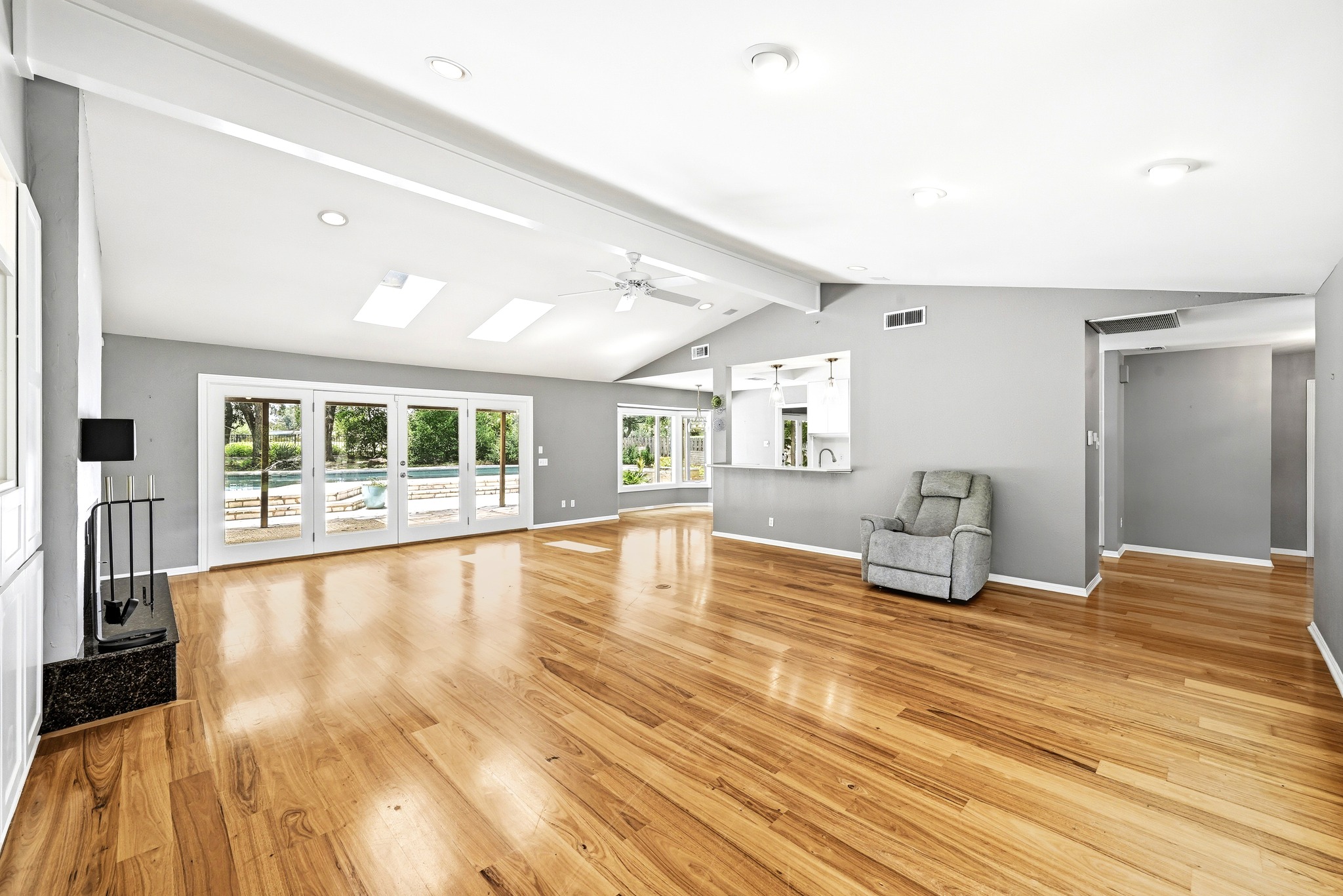 8608 Crest Ridge Circle Austin, TX 78750 - Photo 8 of 38 Vast hardwood floors and vaulted ceilings elevate this sun-drenched great room.