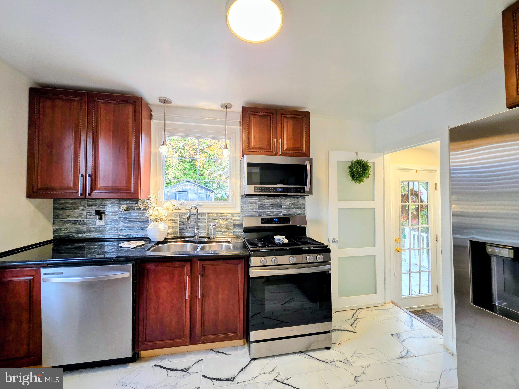 3712 West Cold Spring Lane Baltimore, MD 21215 - Photo 27 of 39 Modern kitchen with sleek finishes.