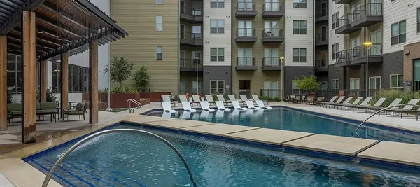 a patio with a table and chairs