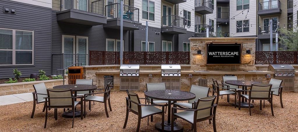 930 Ridgeview Drive, Unit 1262 Allen, TX 75013 - Photo 12 of 28 a patio with a table and chairs