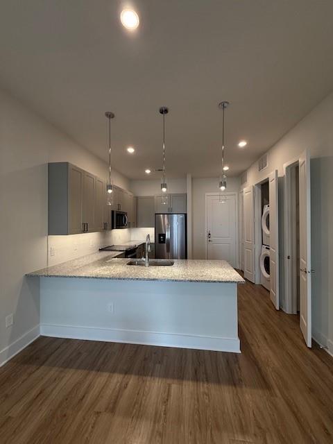 930 Ridgeview Drive, Unit 1262 Allen, TX 75013 - Photo 21 of 28 a large kitchen with stainless steel appliances a large counter top and a wooden floors