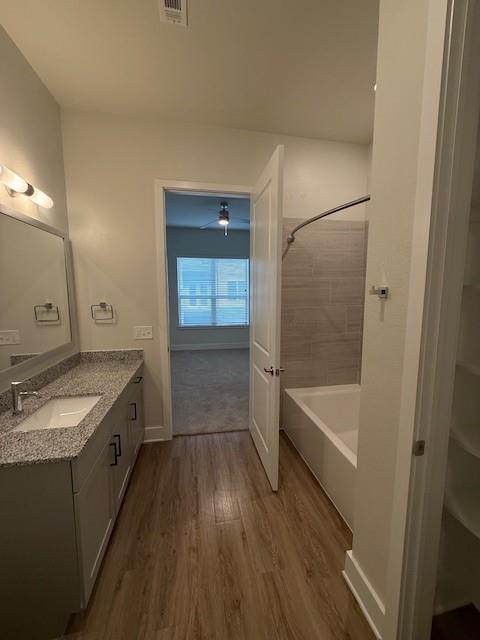 930 Ridgeview Drive, Unit 1262 Allen, TX 75013 - Photo 26 of 28 a bathroom with a granite countertop tub sink and mirror
