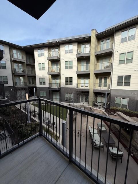 930 Ridgeview Drive, Unit 1262 Allen, TX 75013 - Photo 28 of 28 a view of a brick building from a balcony