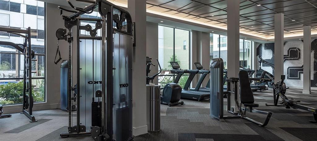 930 Ridgeview Drive, Unit 1262 Allen, TX 75013 - Photo 8 of 28 a view of gym equipment and building in the background