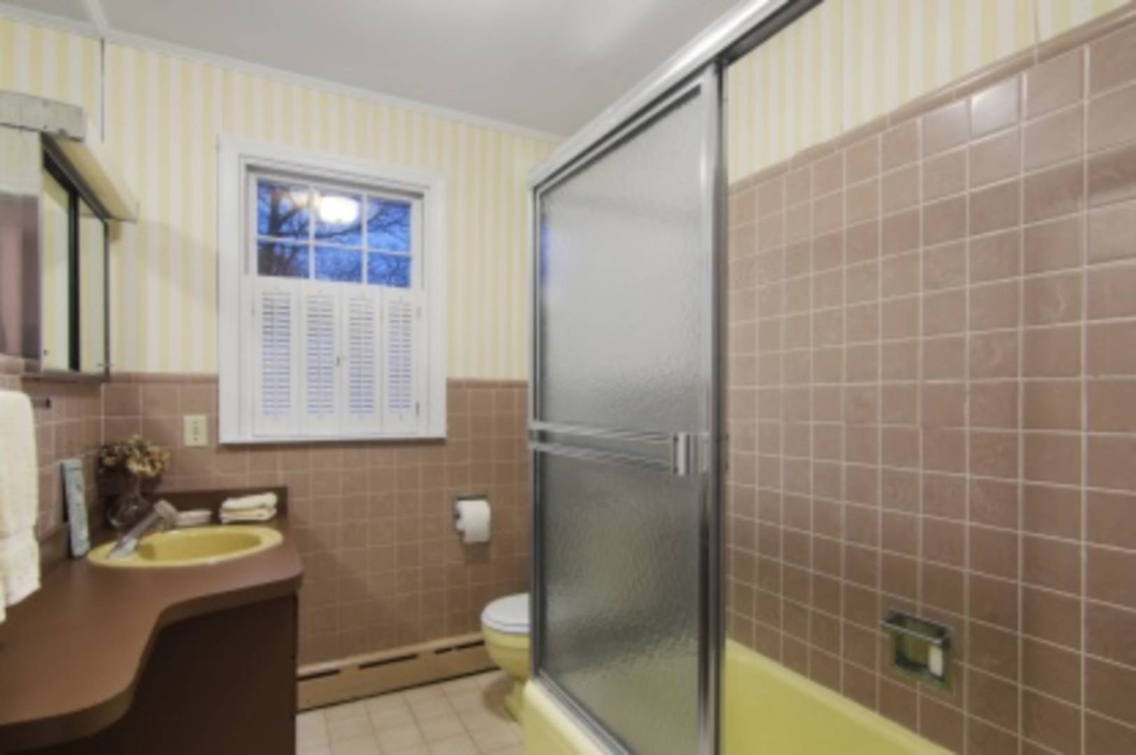 58 Mill Road Sag Harbor, NY 11963 - Photo 6 of 8 a bathroom with a granite countertop sink toilet and shower