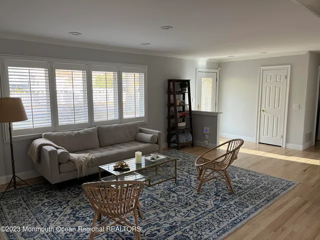 a living room with furniture and a rug