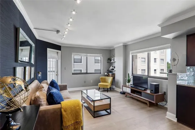 a kitchen with a sink cabinets and stainless steel appliances