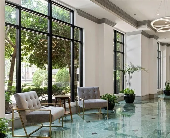 a swimming pool with outdoor seating and yard