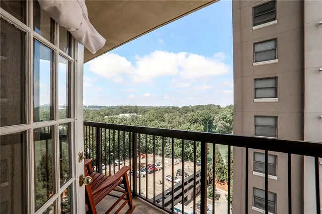 a living room with furniture gym equipment and a fireplace