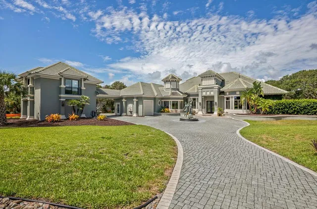an aerial view of a house with a lake view