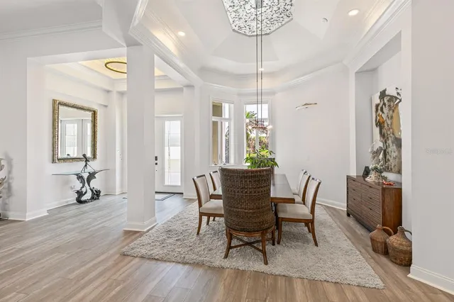 a view of a lake with a table and chairs