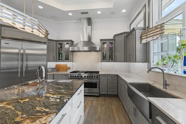 a living room with a baby crib furniture and a wooden floor