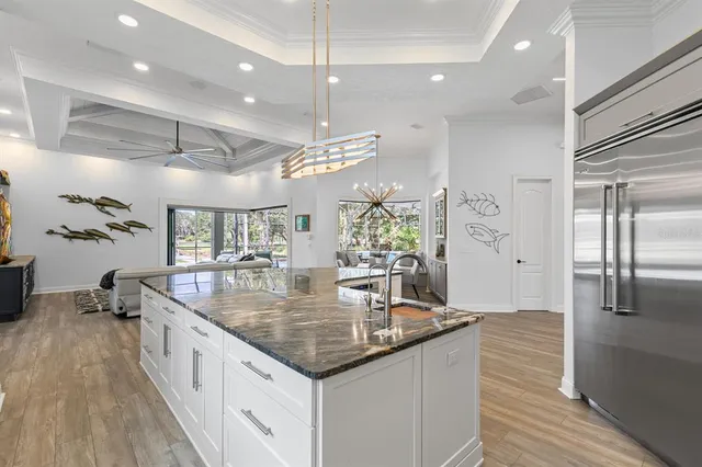 a spacious bathroom with a granite countertop sink mirror and bathtub