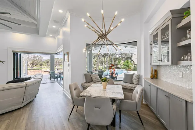 a spacious bathroom with double vanity a mirror a bathtub and a shower