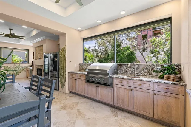 a spacious bathroom with a granite countertop sink a mirror and a shower