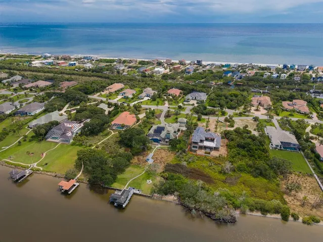 a large kitchen with kitchen island a large island a sink stainless steel appliances and cabinets