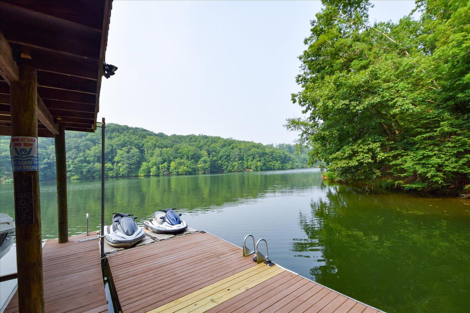 1851 Morris Road Goodview, VA 24095 - Photo 37 of 51 a wooden deck with lake view