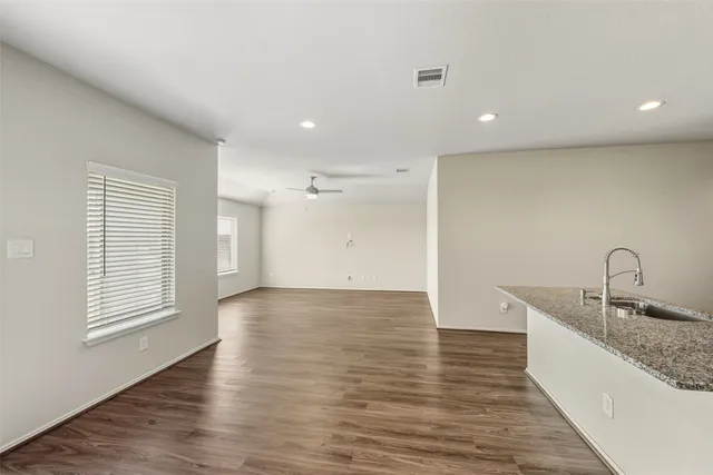 a view of a kitchen counter top space and windows