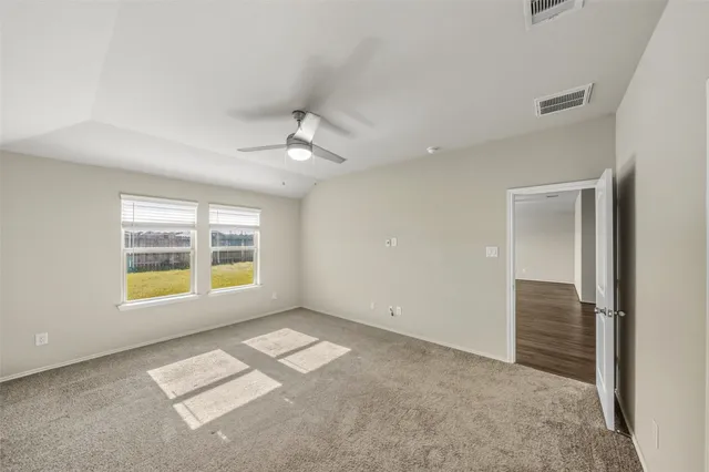 a view of an empty room with a window