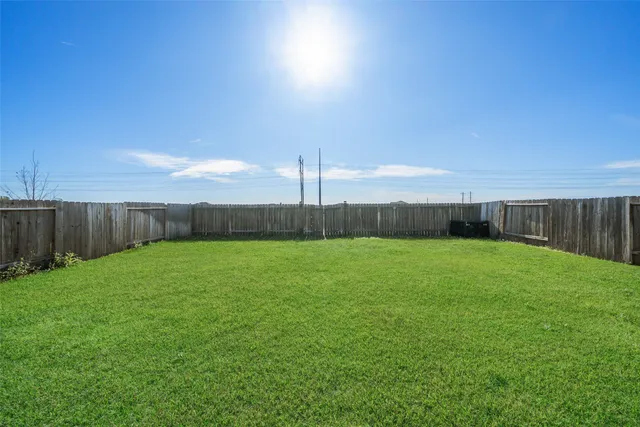 a view of a backyard with green space