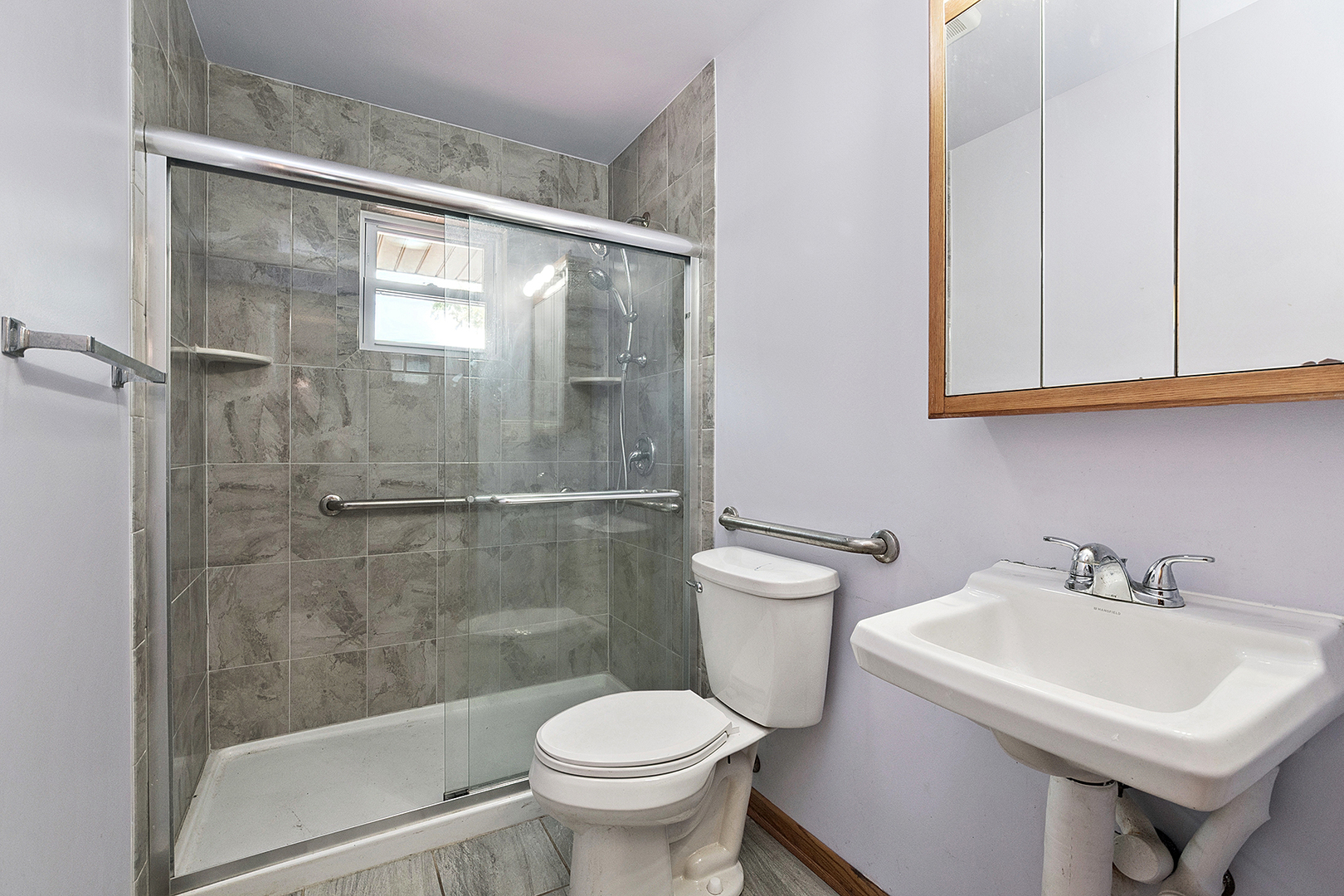 1400 Eunice Avenue Joliet, IL 60433 - Photo 12 of 34 a bathroom with a sink toilet and shower