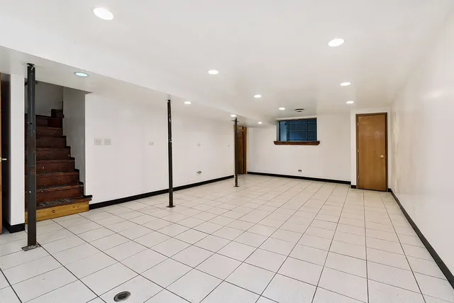 a view of an empty room with an entryway