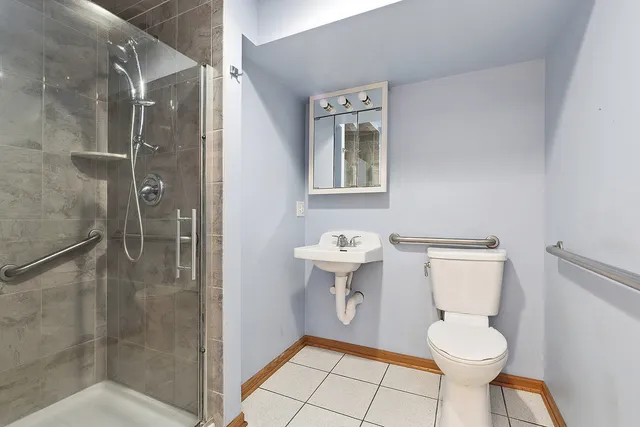 a bathroom with a toilet and a shower