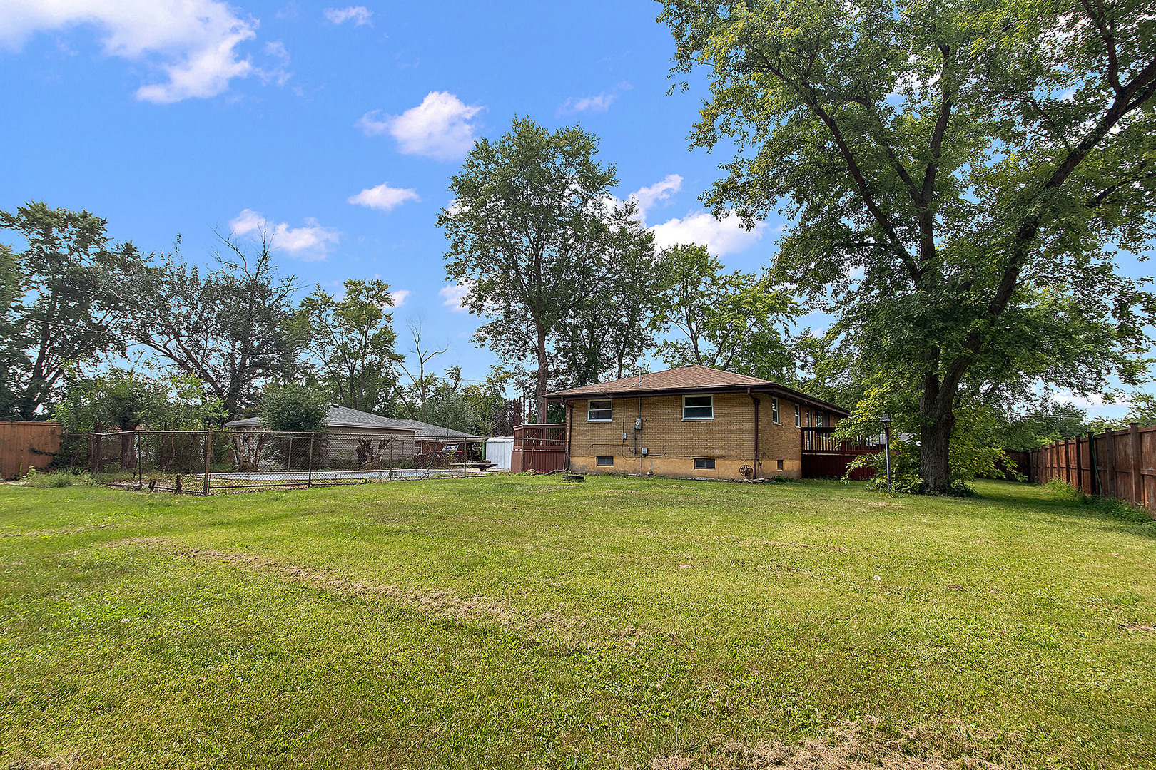1400 Eunice Avenue Joliet, IL 60433 - Photo 26 of 34 a view of a house with a yard and garage