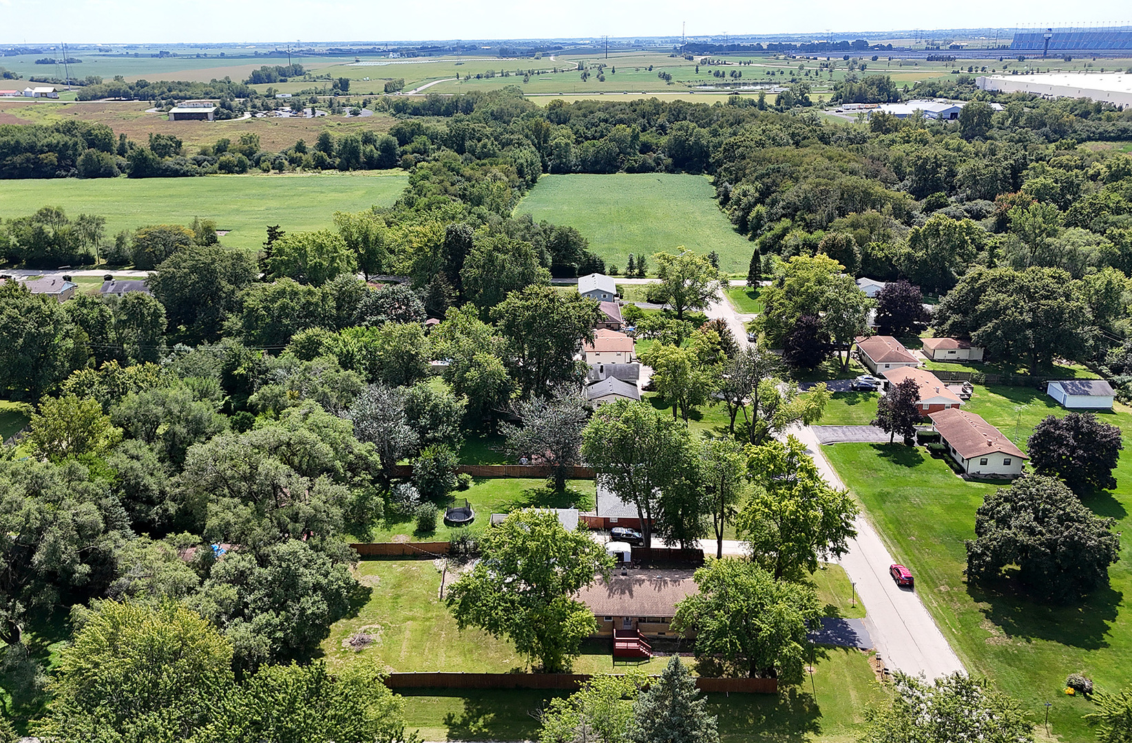 1400 Eunice Avenue Joliet, IL 60433 - Photo 30 of 34 an aerial view of green landscape with trees houses and mountain view