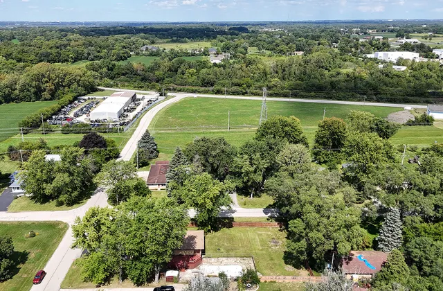 an aerial view of a house with a yard